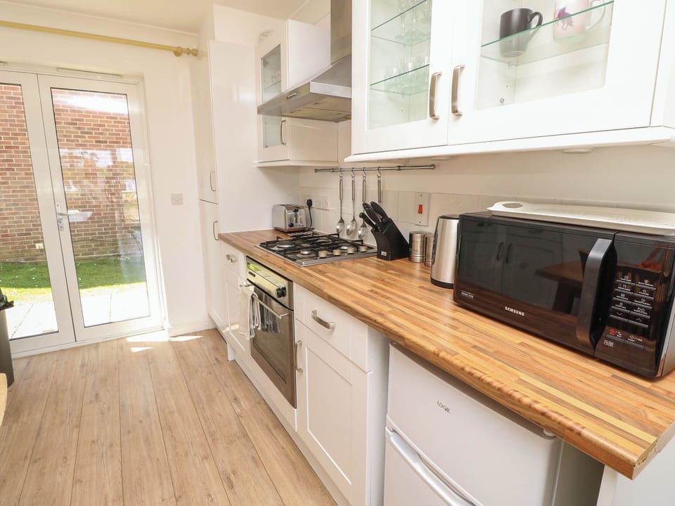Fridge, microwave, toaster, cookware/dishes/utensils