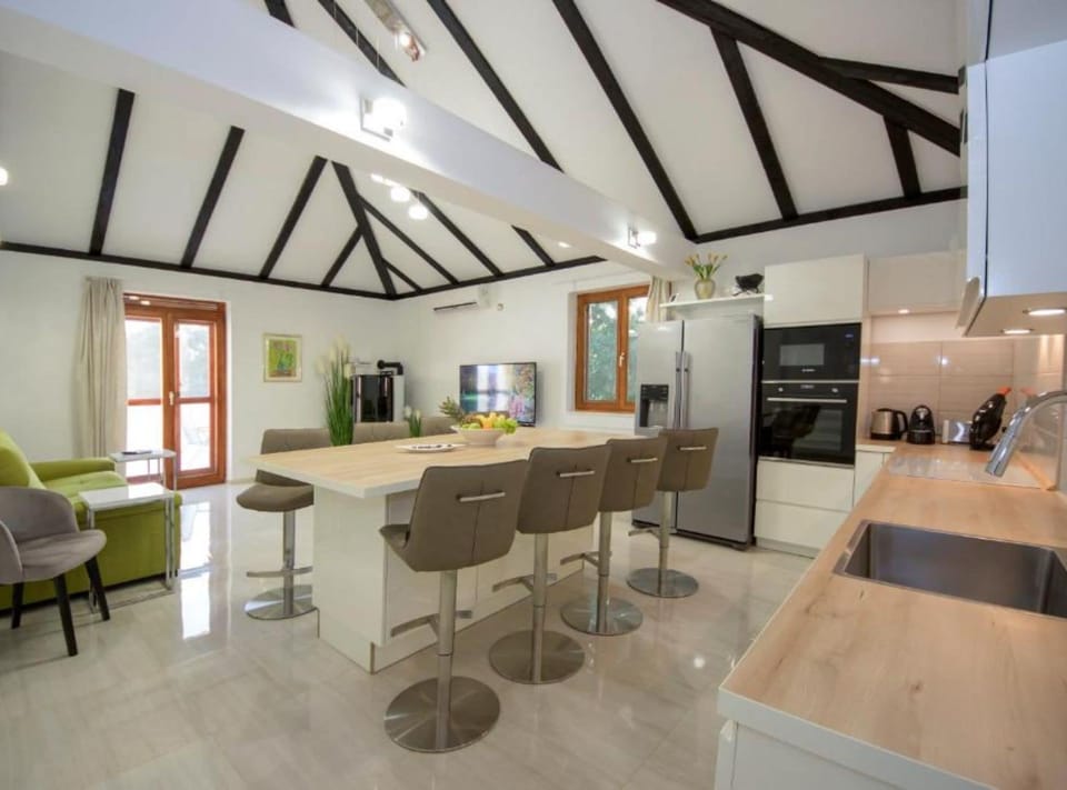 Villa (Three Bedroom Villa with Outdoor Pool) | Living room | 32-inch flat-screen TV with satellite channels