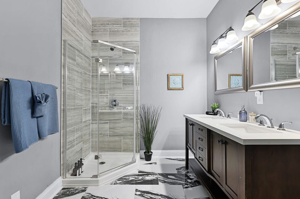 Luxurious Ensuite Bathroom: Enjoy sleek modern fixtures and spacious walk-in shower for ultimate relaxation!