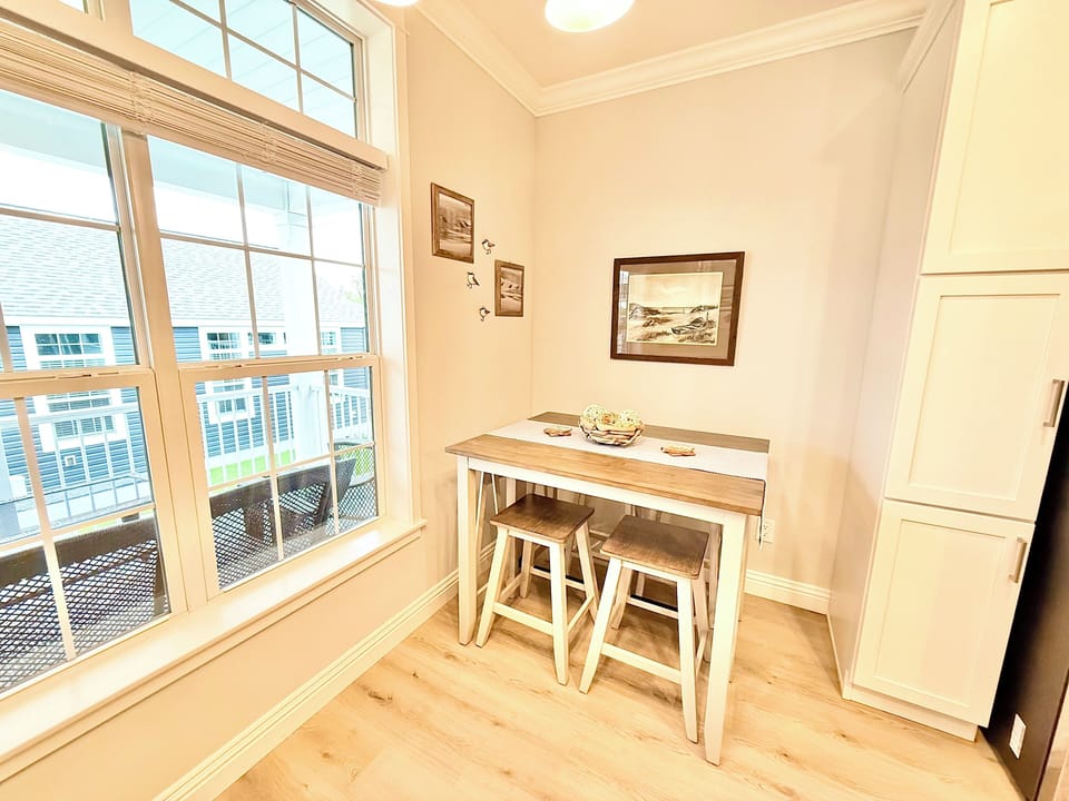 Breakfast Nook with a View
Enjoy quiet mornings or intimate meals in this charming nook, surrounded by natural light and views of the community outside.