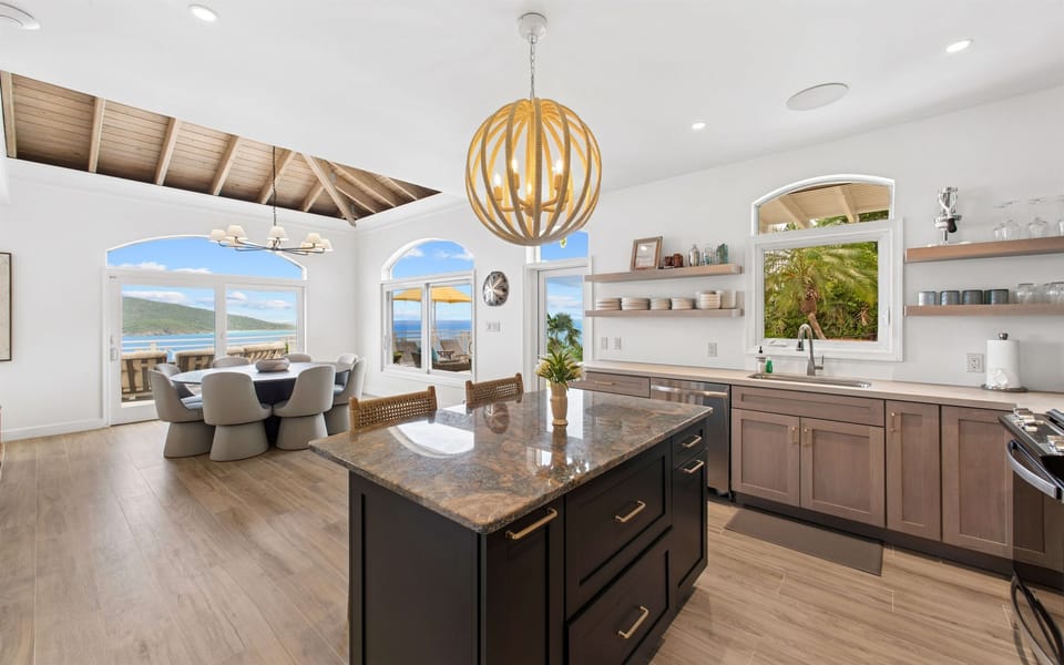 Fully stocked kitchen with stainless appliances, bar seating, coffee maker, blender, and all the tools to cook or sip in style. Enjoy free Wi-Fi throughout the villa.