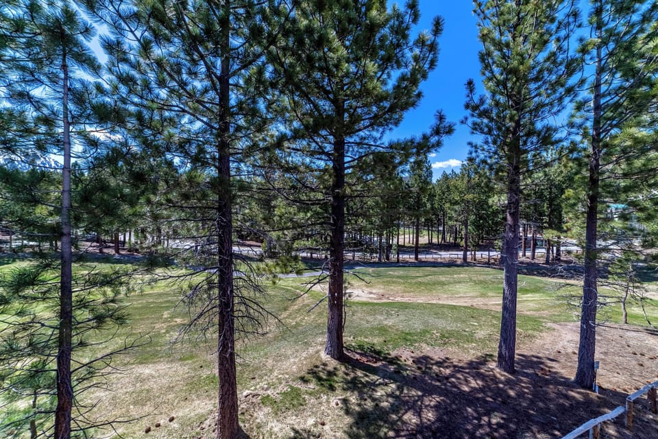 Stunning View of Sierra Star Golf Course and pine tree forest from primary bedroom deck.