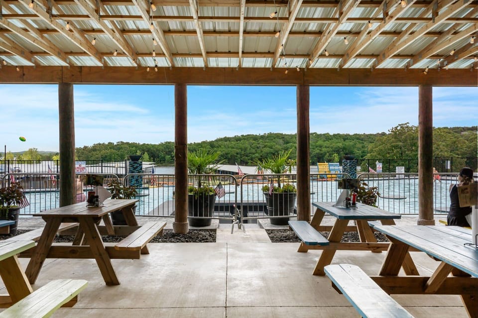 Gather, laugh, and dine together! Enjoy casual island-inspired meals and laid-back fun under the twinkling lights at Rock Island Tiki Bar's vibrant outdoor picnic area.