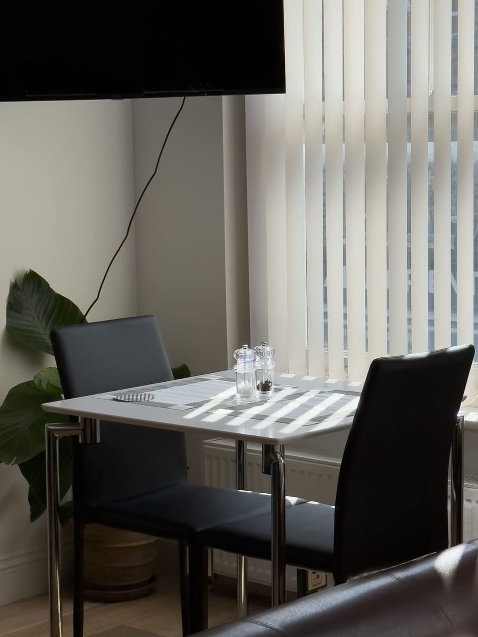Cosy dining area for two—the perfect spot to enjoy breakfast, share a meal or unwind with a cup of coffee