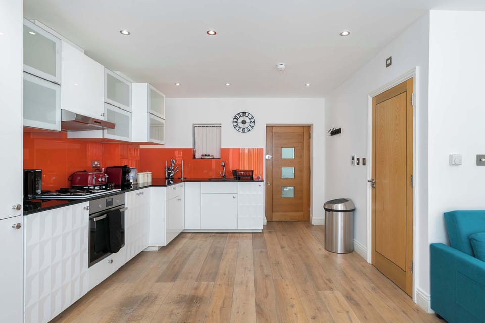 Beautifully designed modern kitchen, fully equipped with everything you need to cook, dine and feel right at home throughout your stay