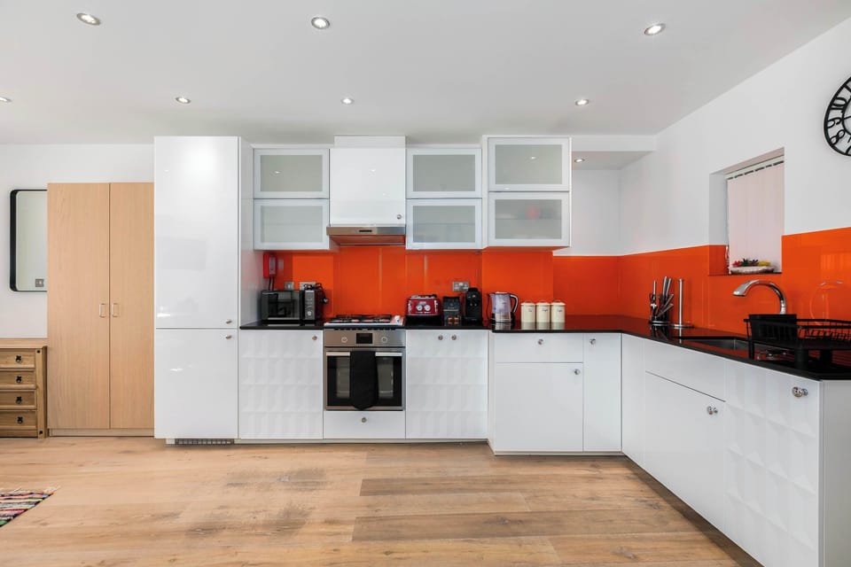 Sleek, fully equipped kitchen thoughtfully designed with modern appliances and all the essentials for effortless cooking throughout your stay