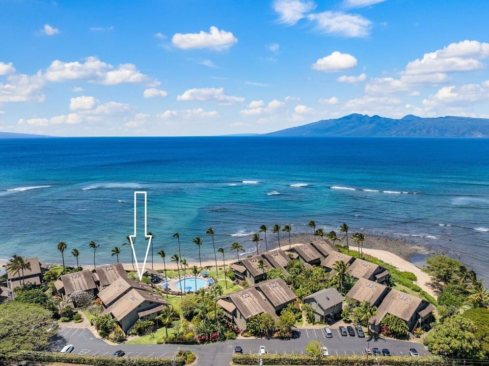 Aerial view of Maui's pristine coastline and turquoise waters, showcasing the property's unbeatable oceanfront location.