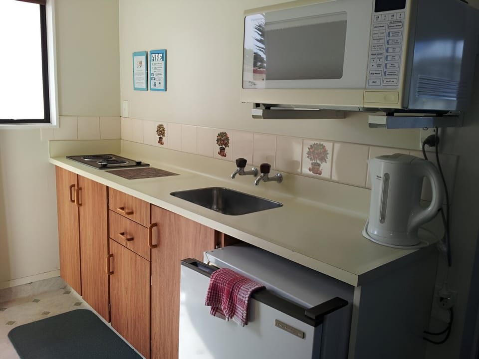 Family Suite, Patio | Private kitchen | Microwave