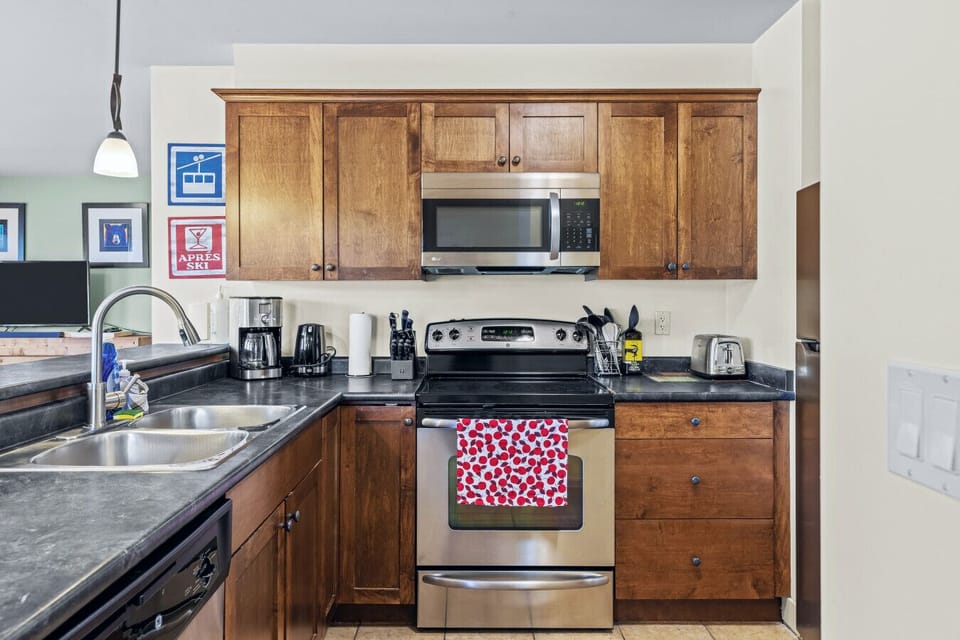 Whip up your favorite dishes in the fully equipped kitchen featuring sleek stainless steel appliances