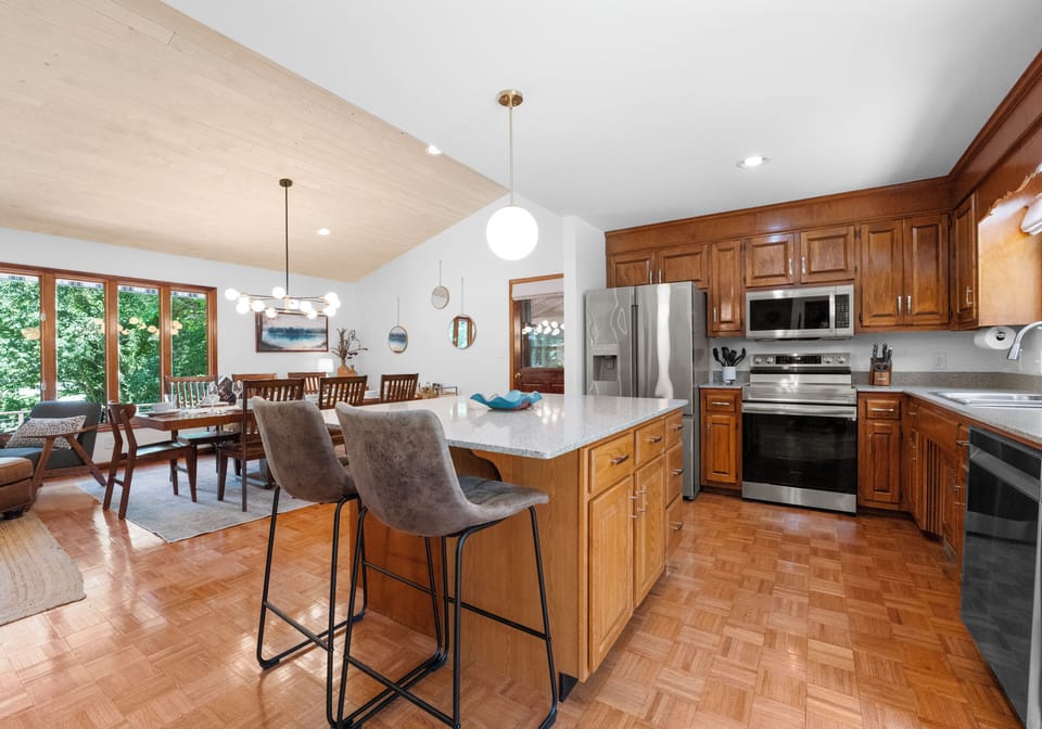 Enhance your breakfast experience with the kitchen island and barstool seating.