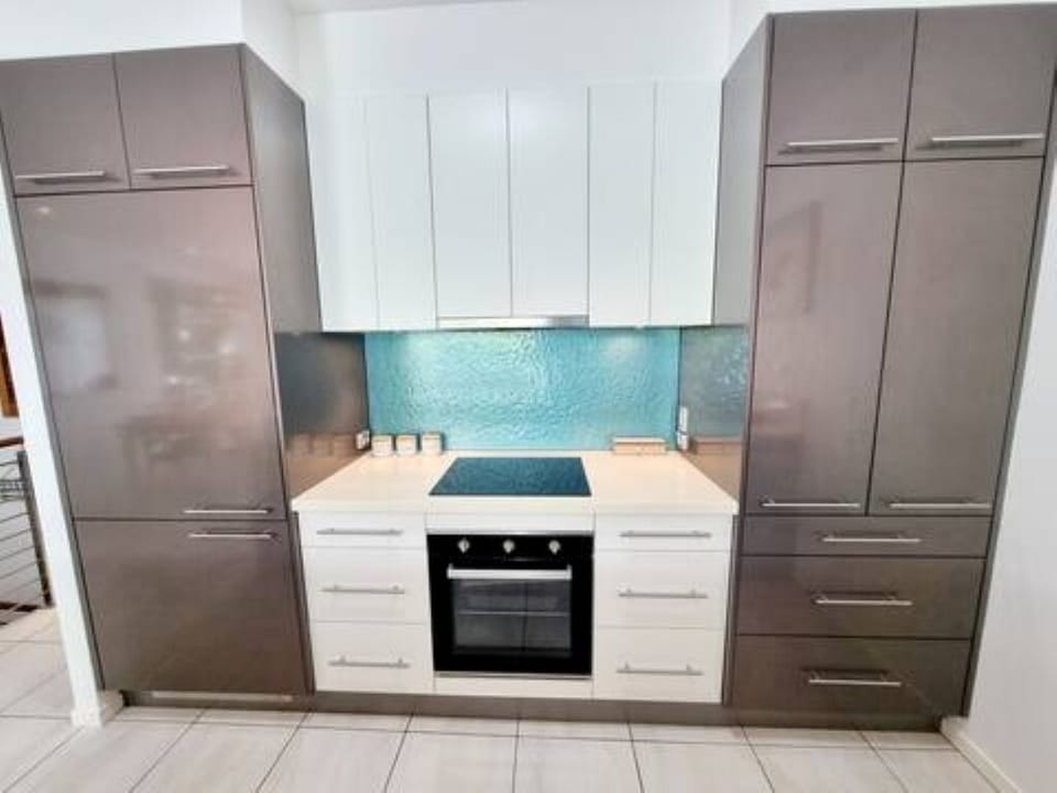 Fully stocked kitchen with coffee pod machine, kettle, toaster