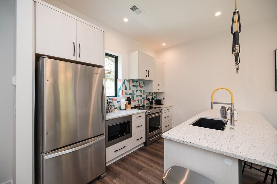 Chef-inspired kitchen featuring top-of-the-line KitchenAid appliances, quartz countertops, and everything needed for cooking and entertaining.