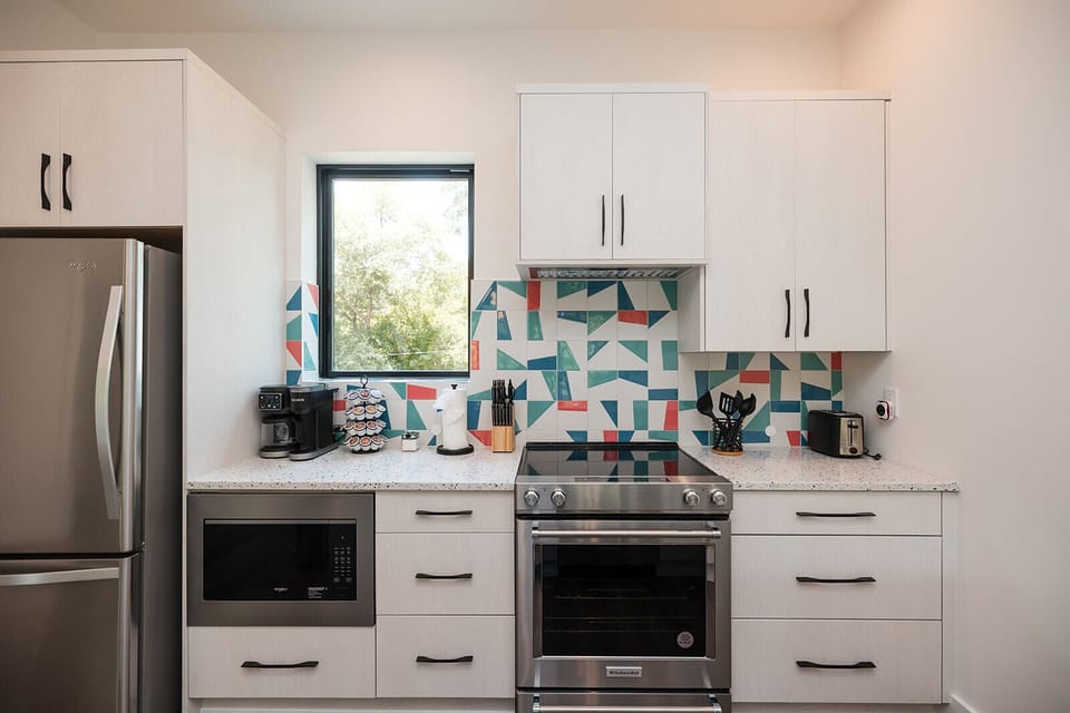 Chef-inspired kitchen featuring top-of-the-line KitchenAid appliances, quartz countertops, and everything needed for cooking and entertaining.