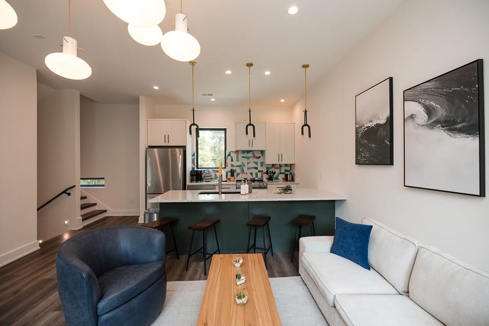Spacious kitchen island and dining area provide the perfect gathering place for family meals, cocktails, and conversation.