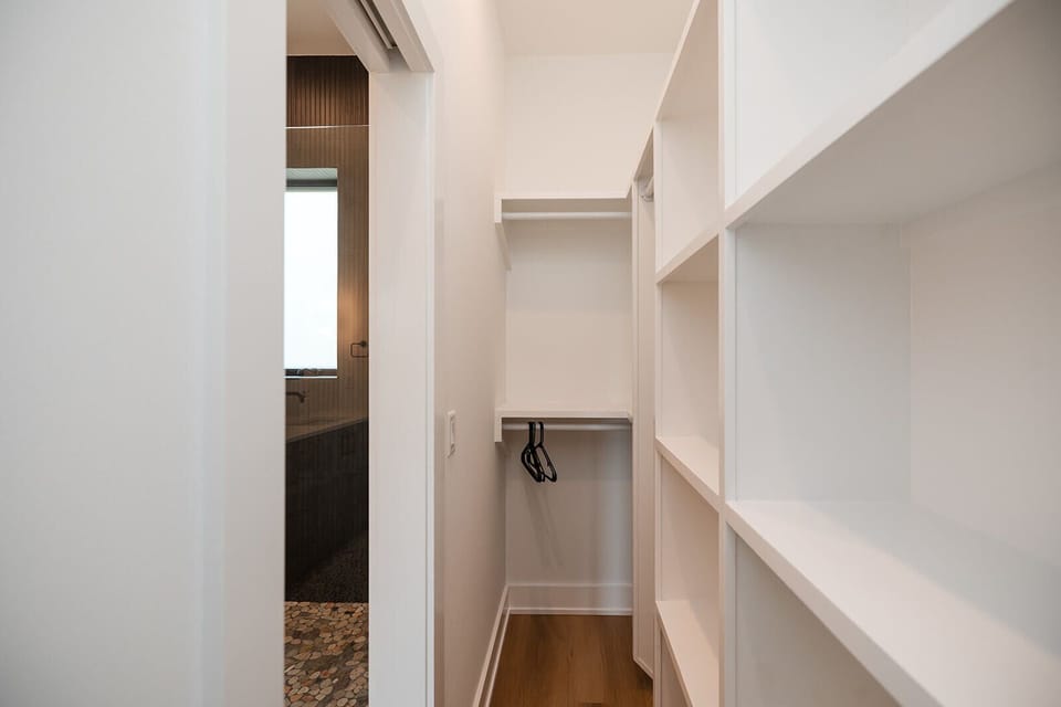 Beautiful spa-style bathrooms feature modern finishes, plush towels, and essential toiletries for a hotel-style stay.