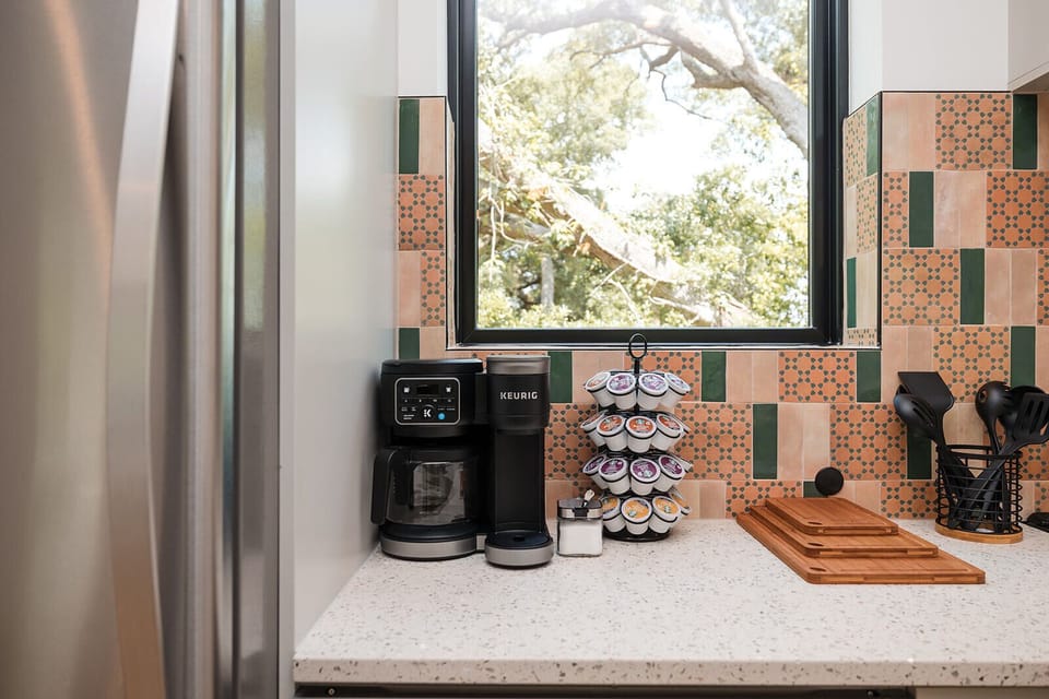 Start your mornings with the Keurig Duo coffee maker, coffee pods, tea selection, and cozy breakfast setup.