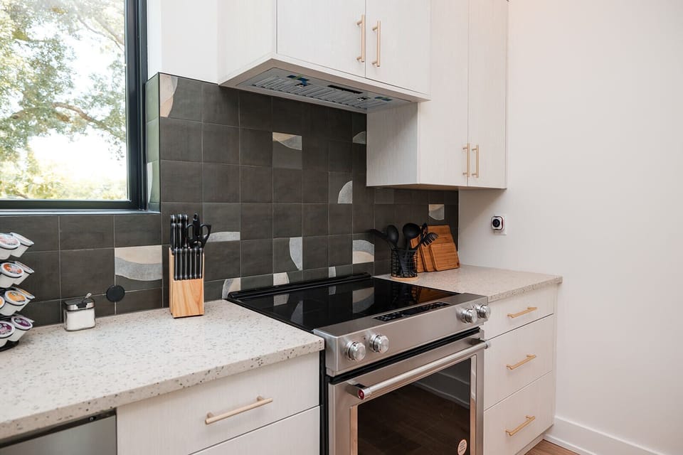 The fully stocked kitchen includes cookware, essentials, and everything needed for preparing meals and hosting guests in style.