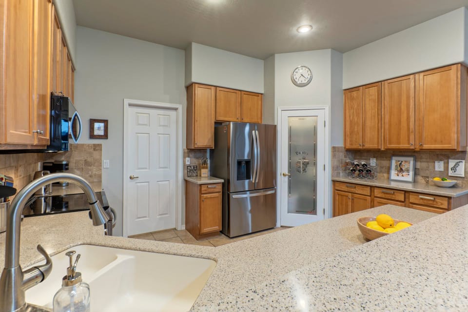 Prepare home cooked meals in well stocked kitchen.