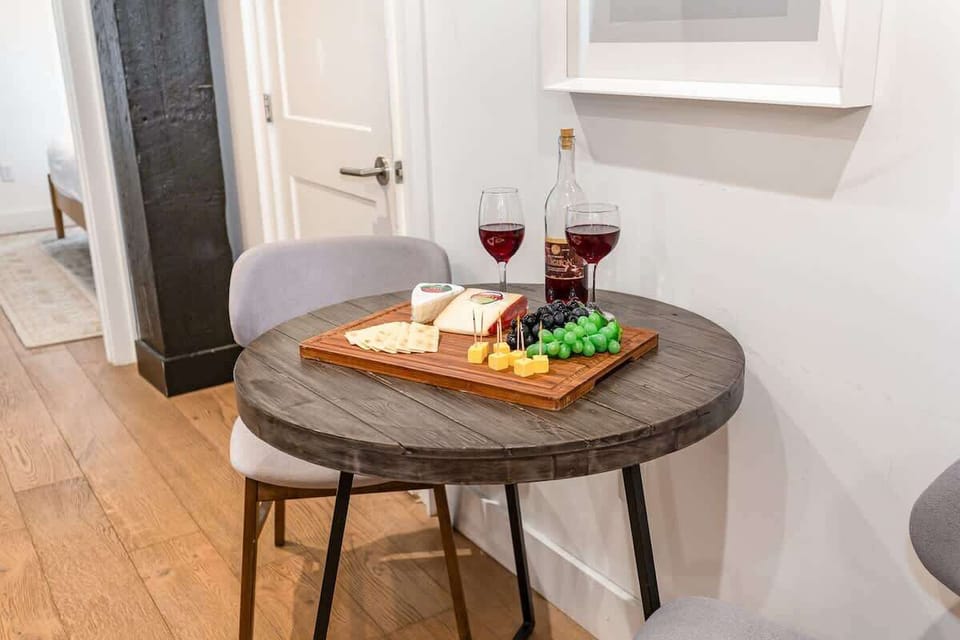 The dining area offers an intimate setting for two, perfect for a quiet meal or morning coffee.