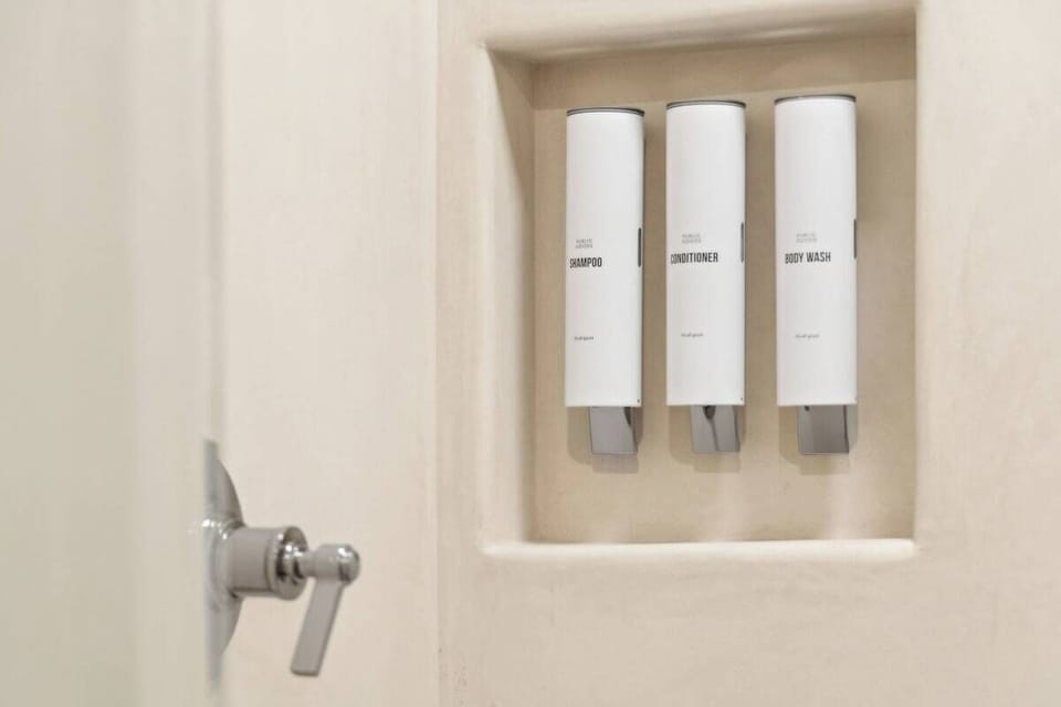 En-suite bathroom with rain shower and high-end toiletries