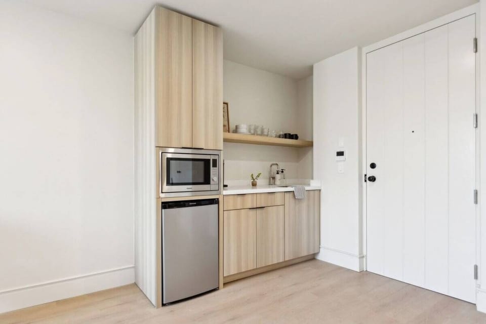 Kitchenette: Nespresso, mini-fridge, microwave/air-fryer. No stove.