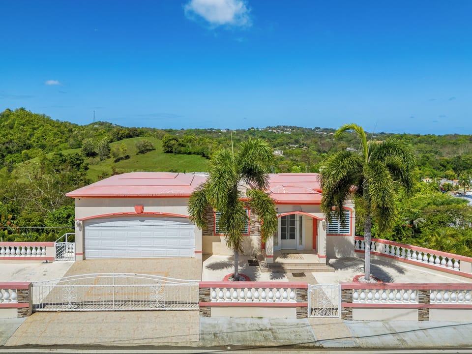 Private retreat surrounded by greenery and ocean horizons.