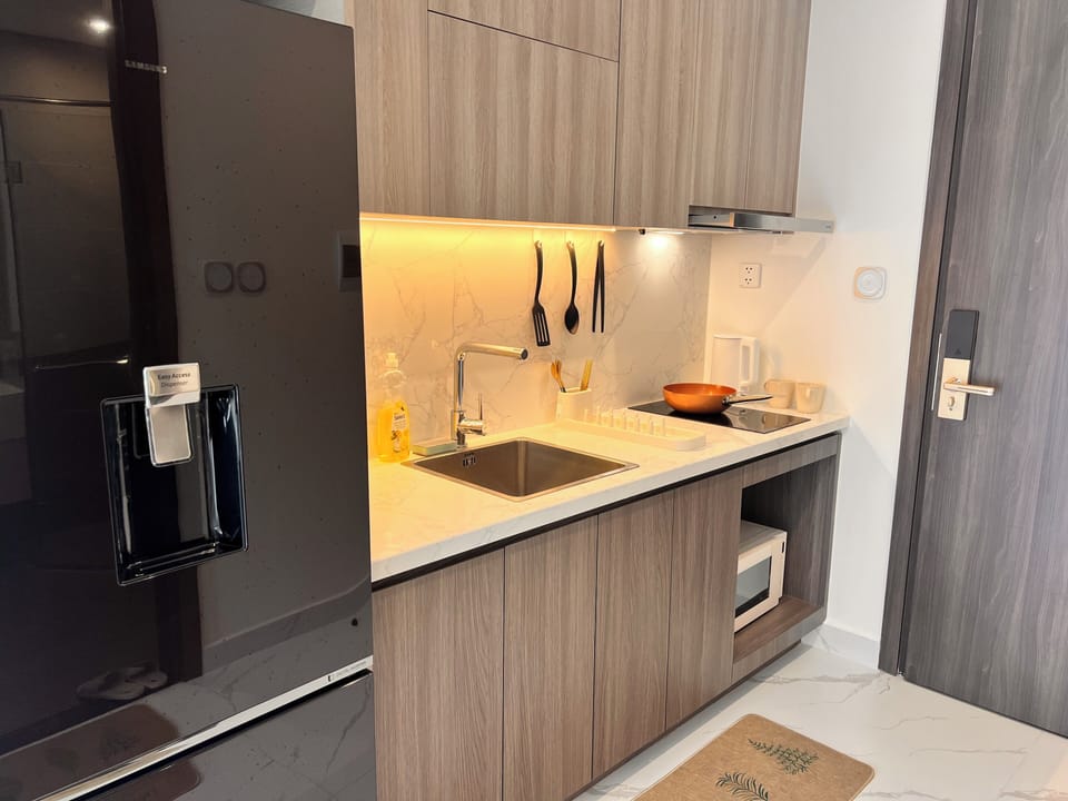 Deluxe Apartment, Balcony, Pool View | Private kitchen | Coffee/tea maker, full-size fridge, stovetop, rice cooker