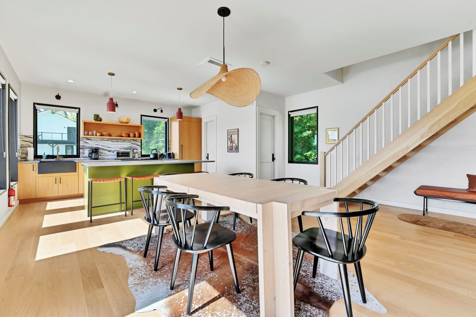 Open concept with full river views, dining room connected to living room and kitchen