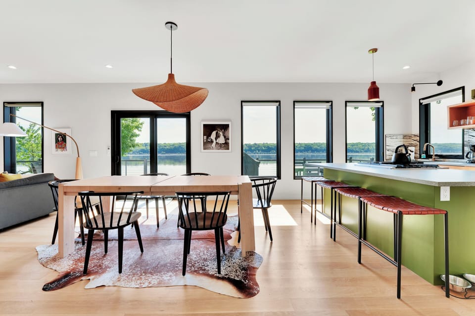 Open concept with full river views, dining room connected to living room and kitchen
