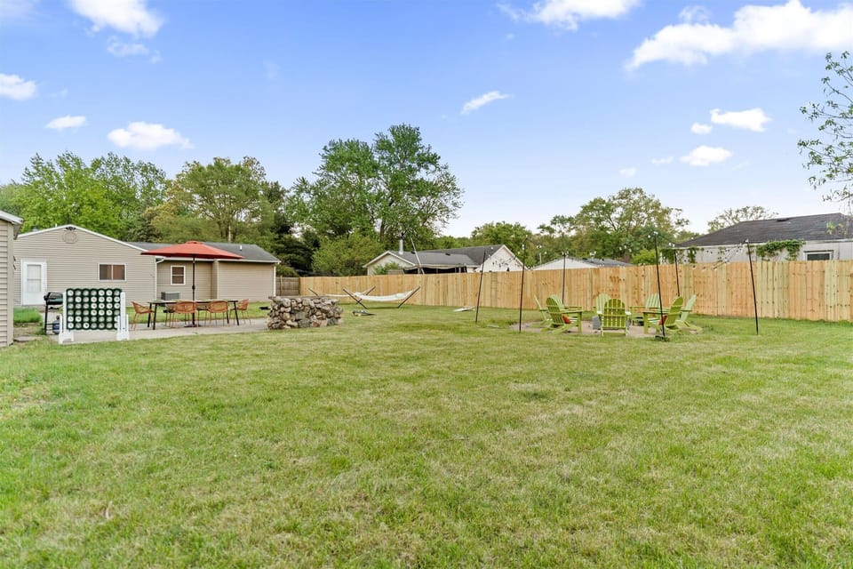 The well-mowed grass enhances the backyard’s beauty