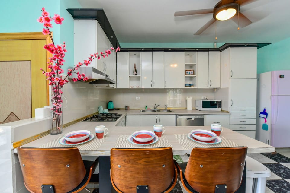 Three bar stools at the kitchen counter for easy snacks
