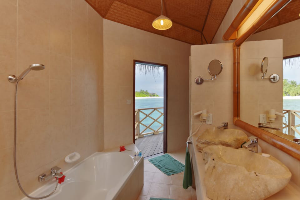 Bungalow, Overwater | Bathroom | Separate tub and shower, free toiletries, hair dryer, bathrobes