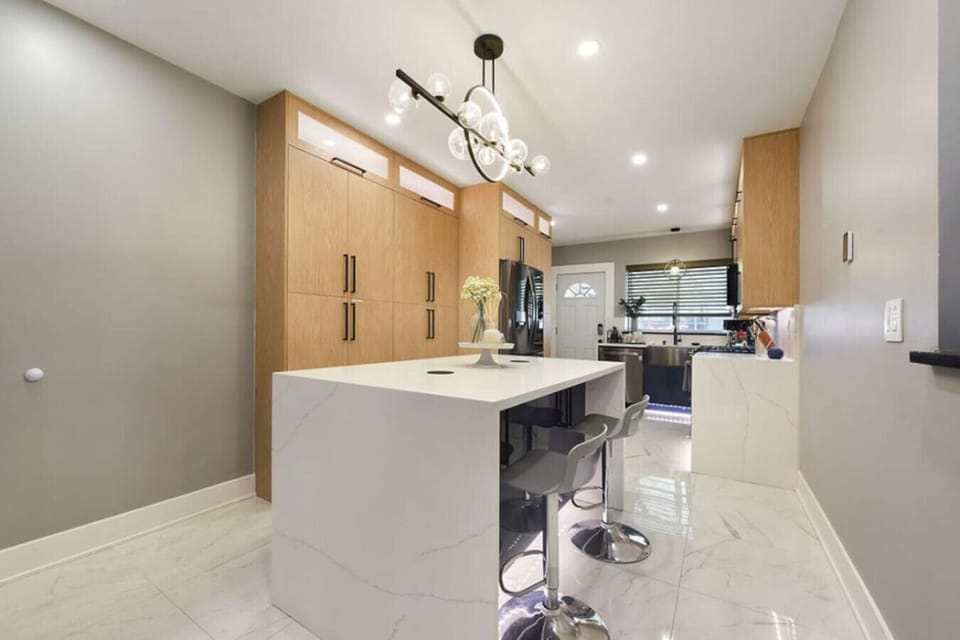 Sleek, fully equipped kitchen with a spacious island for cooking and dining.