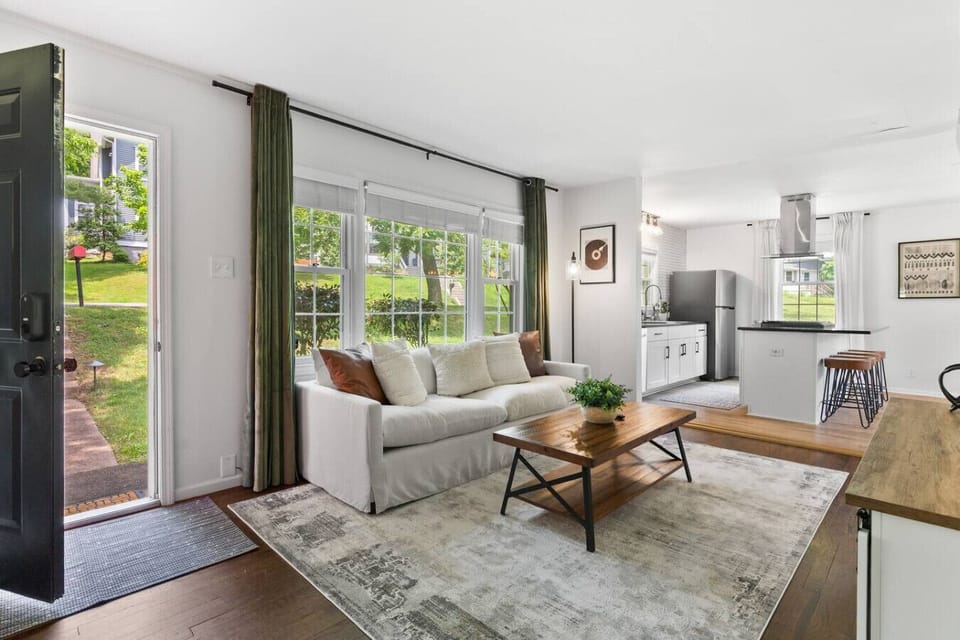 Cozy living room with a Smart TV. Opens up into the kitchen area.