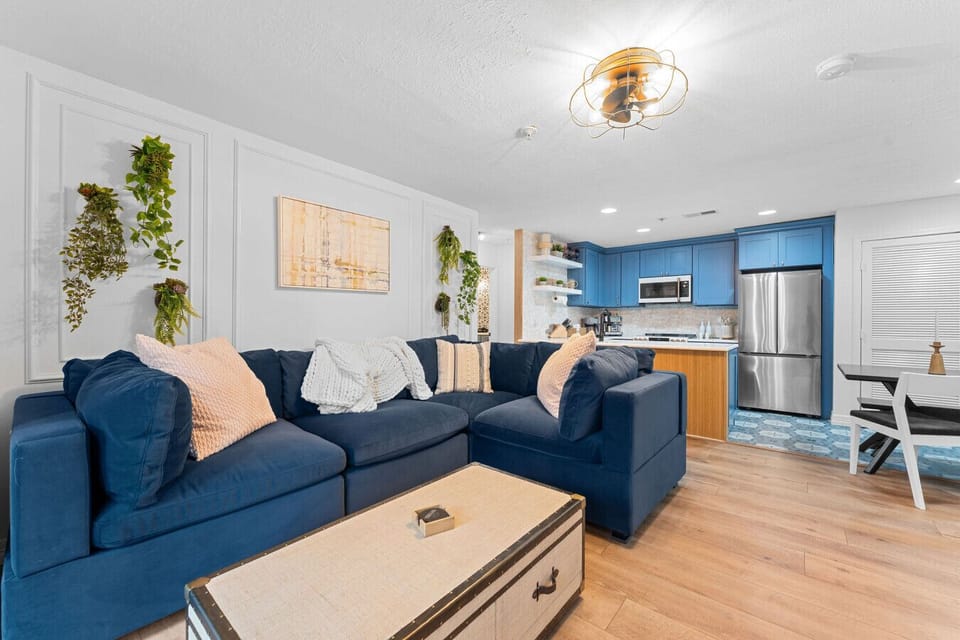 Family room with coffee table filled with games and movies