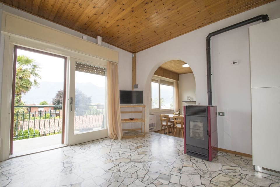 Bright living room with view and access to balcony.