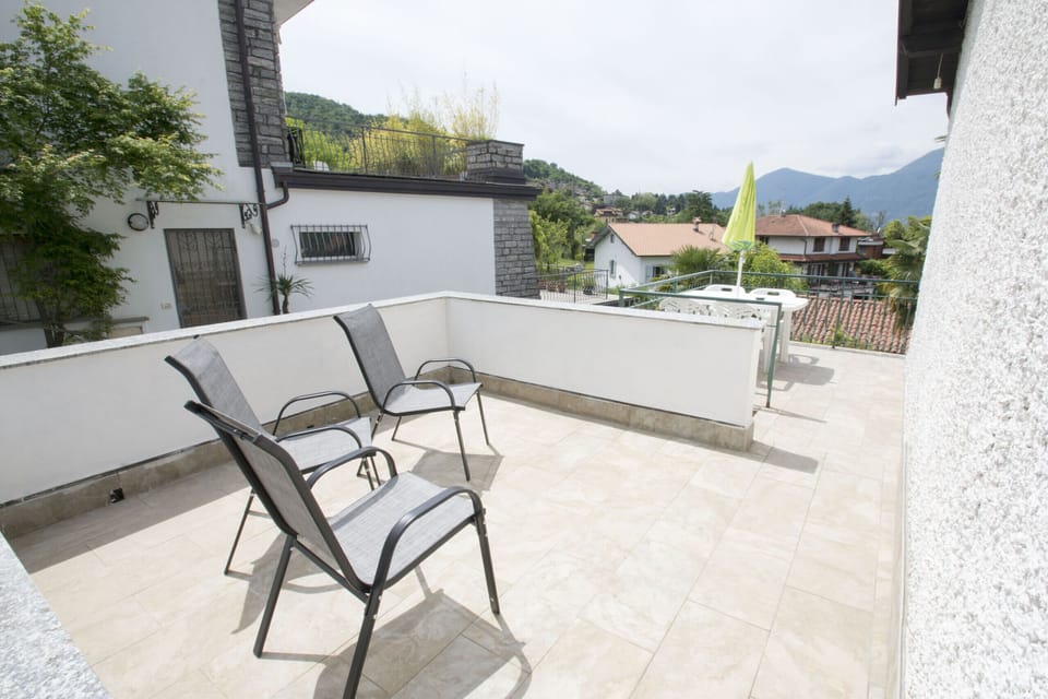 Panoramic terrace with lake view, perfect for outdoor dining.