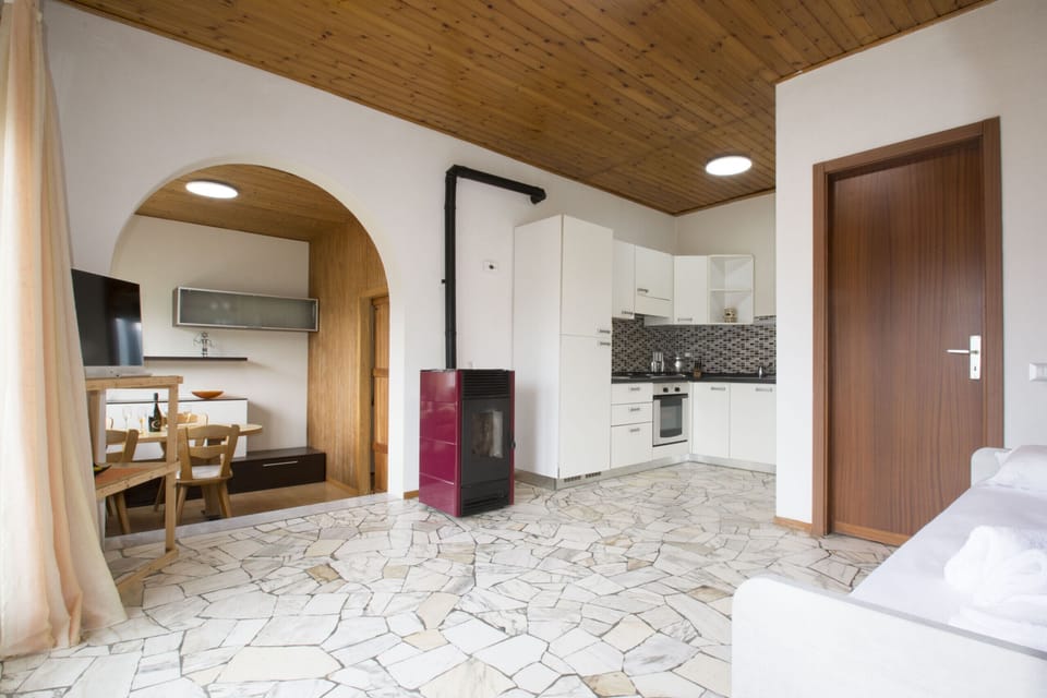 Bright living room with view and access to balcony.