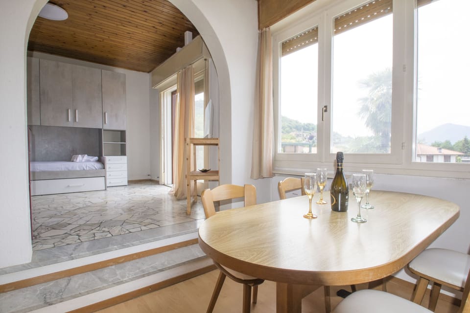 Bright living room with view and access to balcony.