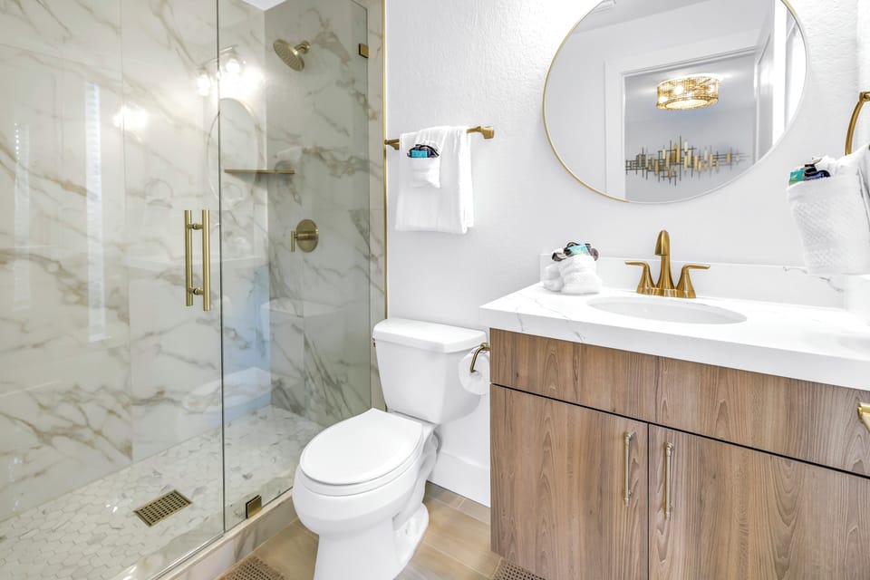 Bath en-suite with step-in shower.