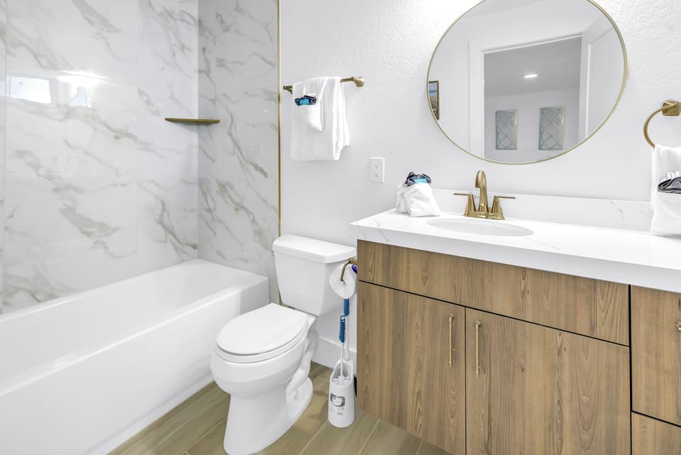 Full bathroom with shower-tub.