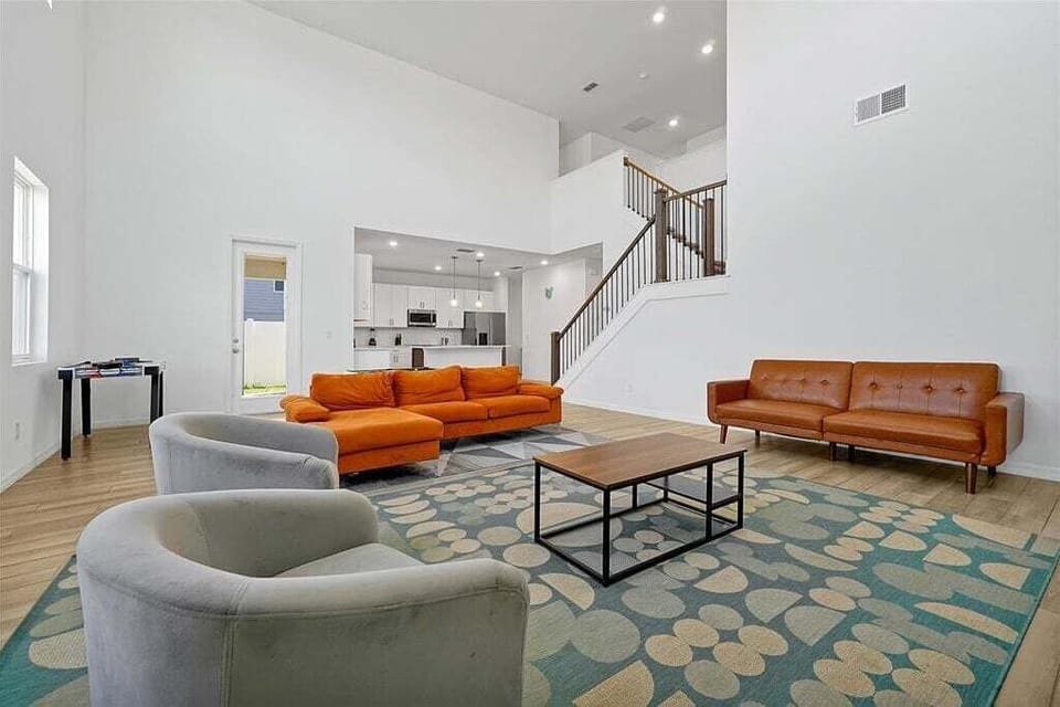 Step into a breathtaking open-concept living room where space, style, and comfort unite. With soaring ceilings and seamless flow, this expansive living area is tailor-made for both relaxed family living and effortless entertaining.