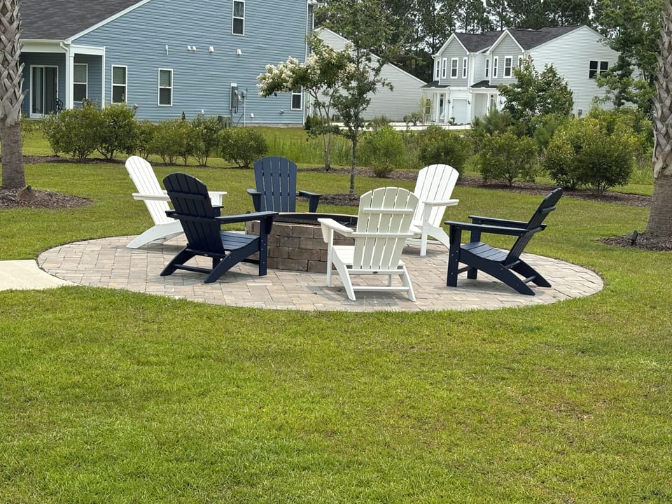 Just a short walk to the outdoor fire pit with seating for all guests to enjoy.