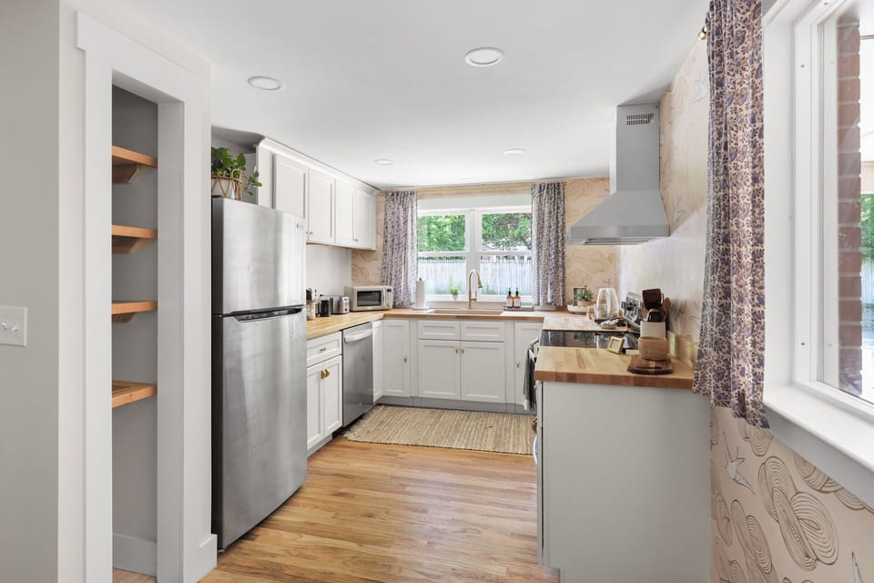 Fridge, freezer, oven, stove, microwave, drip coffeemaker, bean grinder, kettle