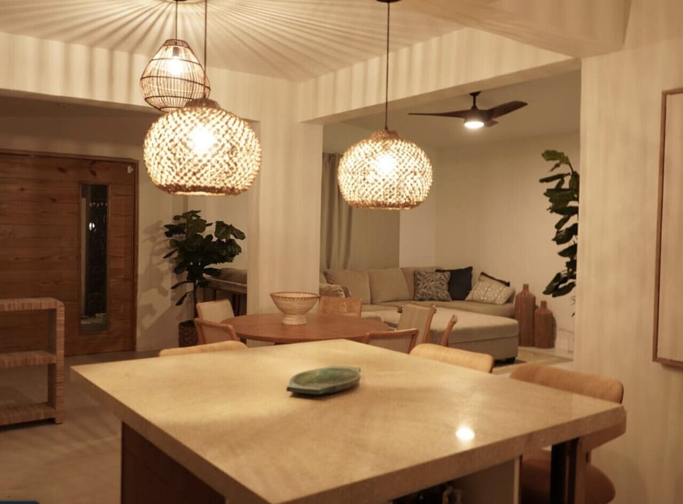Open dining space with two tables, comfortably accommodating up to 8 guests.