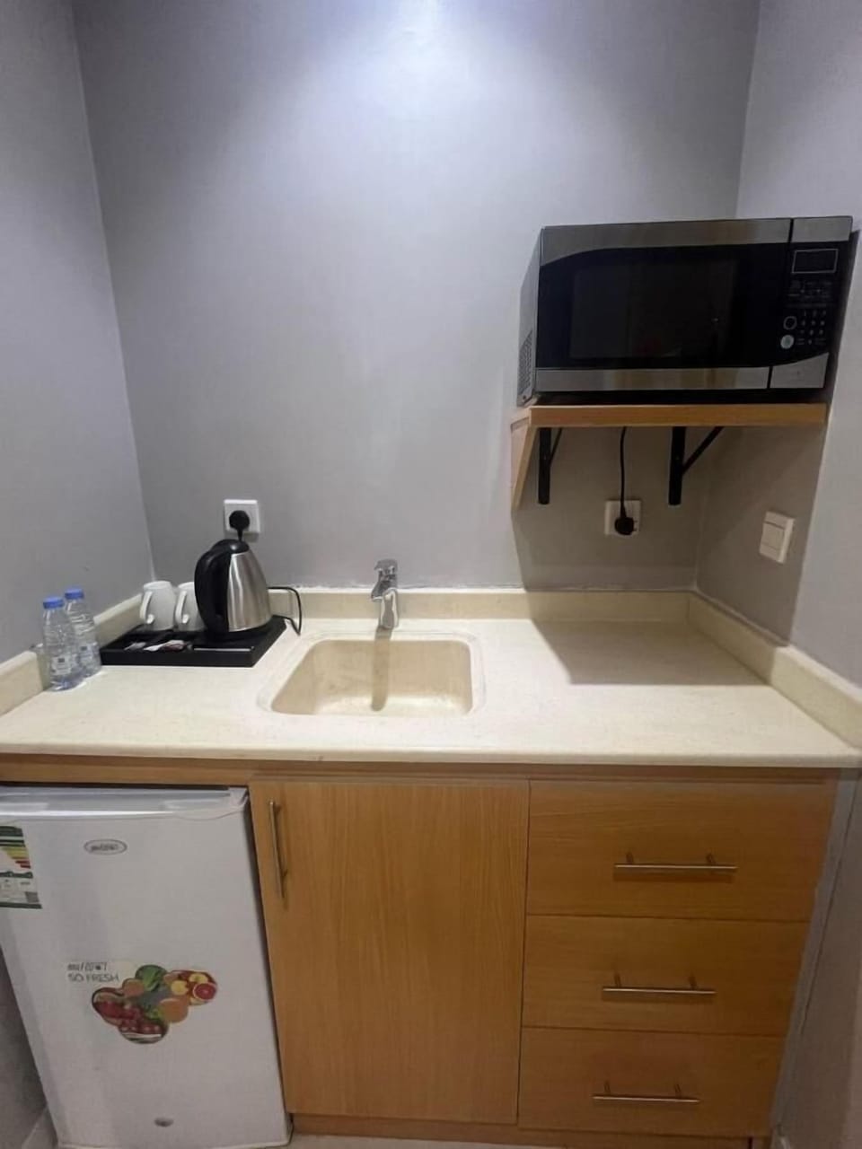 Mini-fridge, microwave, stovetop, cookware/dishes/utensils