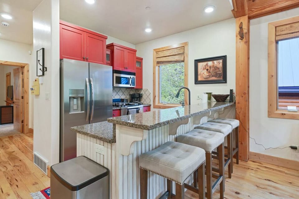 Fully equipped kitchen featuring a central island perfect for meal prep or casual dining.