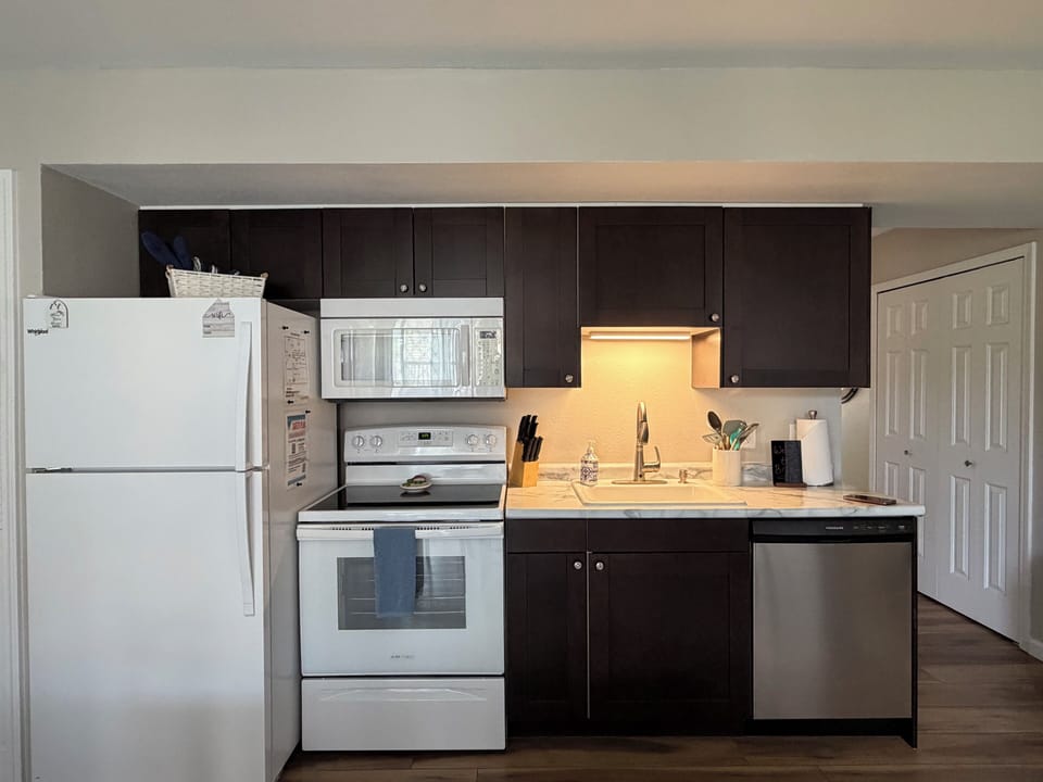 Full size Kitchen with Stove, Refrigerator, Microwave & Dishwasher. 