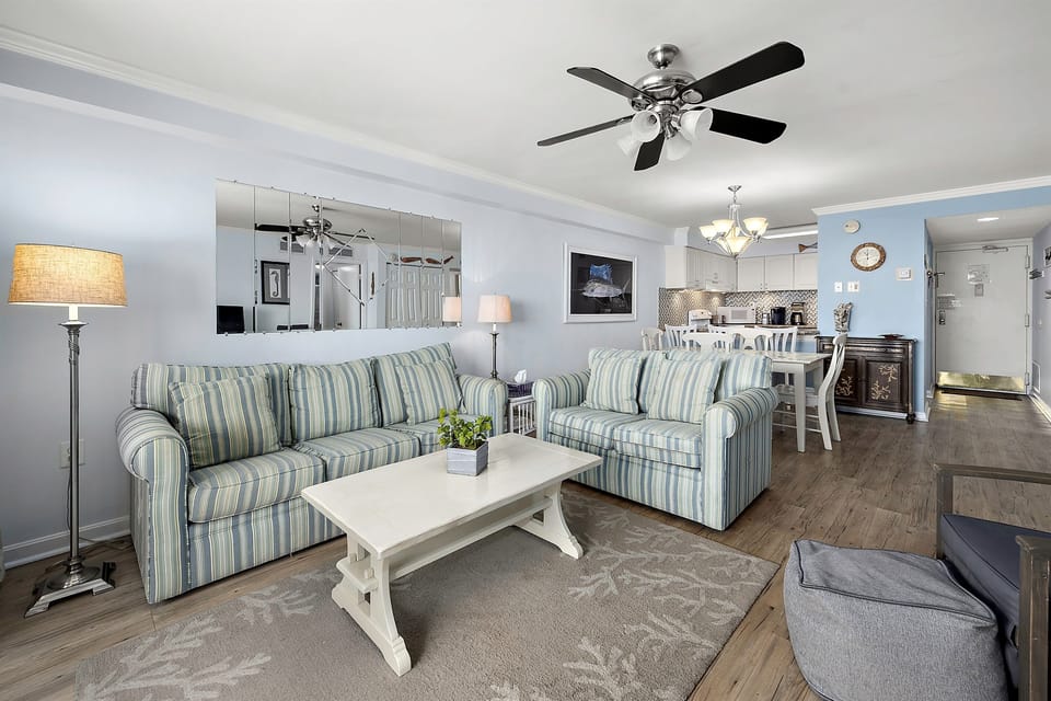 Coastal living room with comfy seating and large TV
