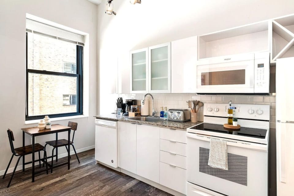 As you approach kitchen the elegant layout and well-stocked shelves make it the ideal spot to relax.